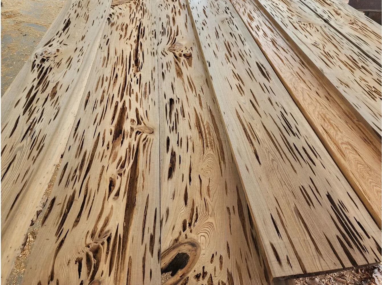 Stacked Cypress (Cupressus) wood beams, known for their natural durability and strength.